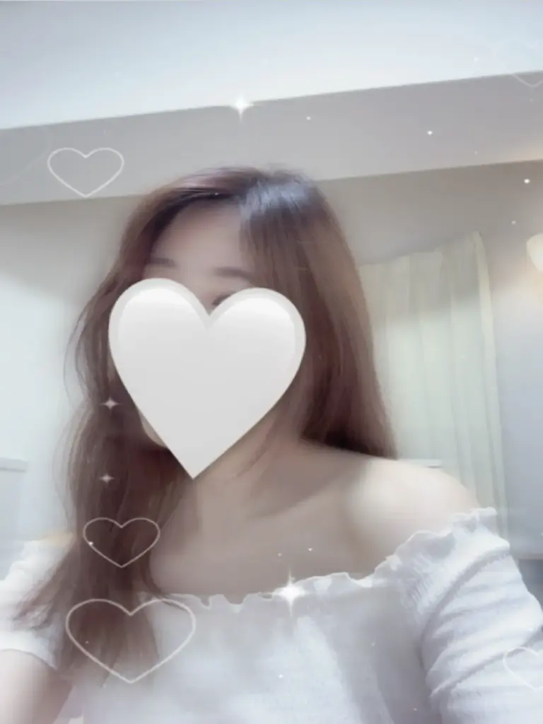 a woman with a heart shaped object over her face